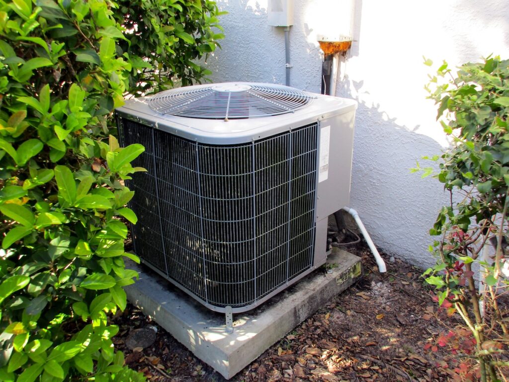 best air conditioner brandsAir Conditioning Unit On Side of Florida House with Green Bushes
