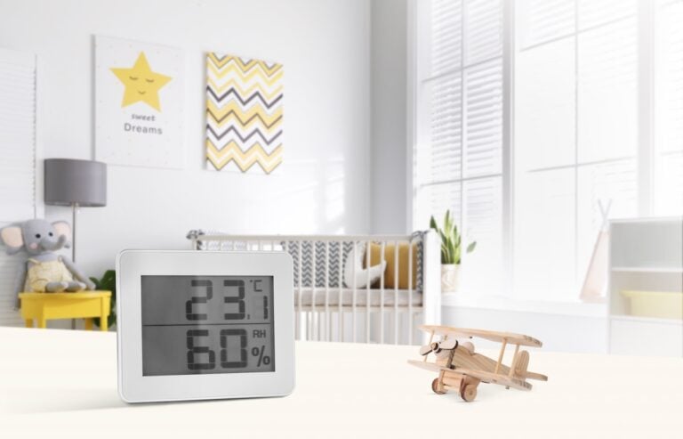 Cute baby room interior with crib and big window