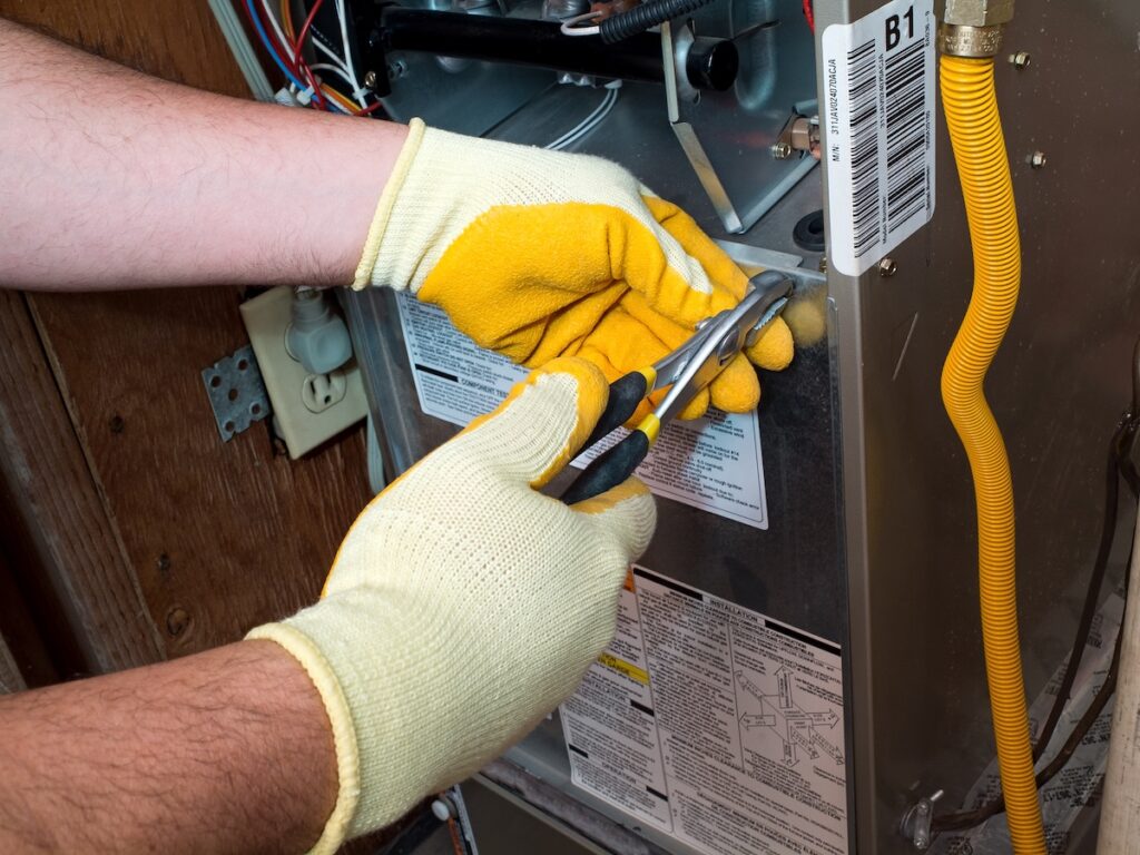 emergency furnace repair Hispanic air conditioning technician