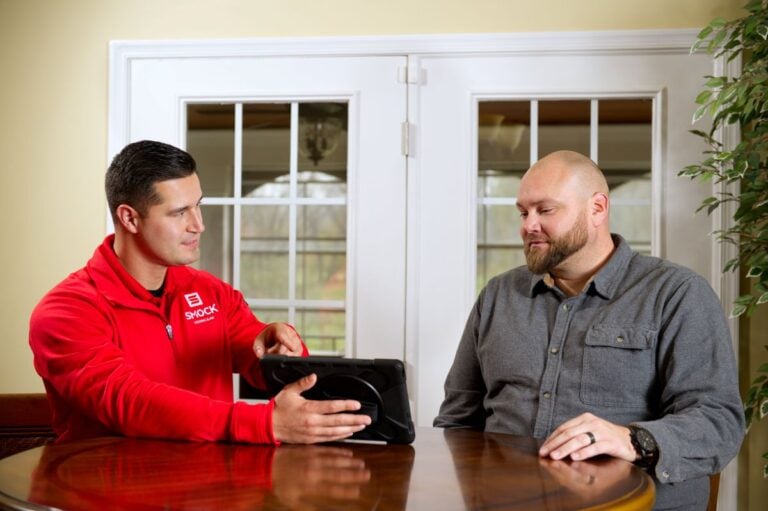 hvac financing houseowner and worker talking about financing air conditioning project