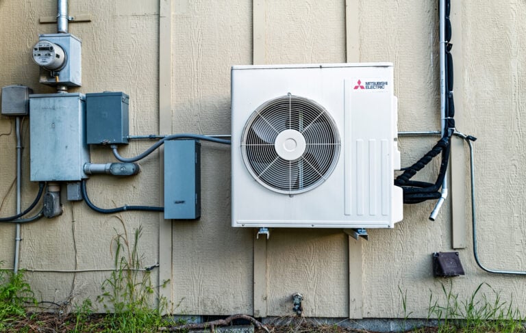 Mitsubishi air conditioner compressor fan installed on the exterior of a building in central Oregon, USA
