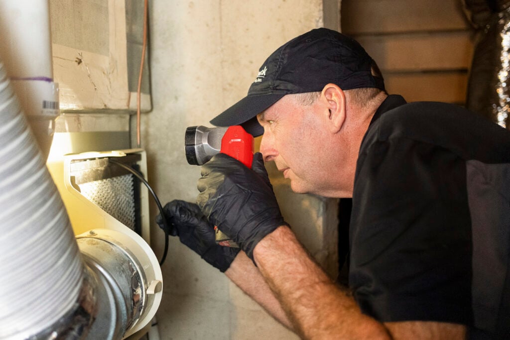 Smock HVAC worker