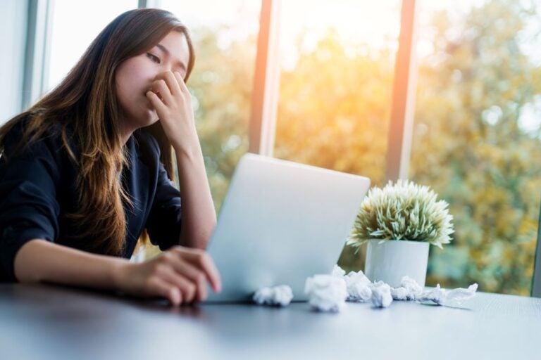 best hvac filter for allergies young woman sneezing inside office