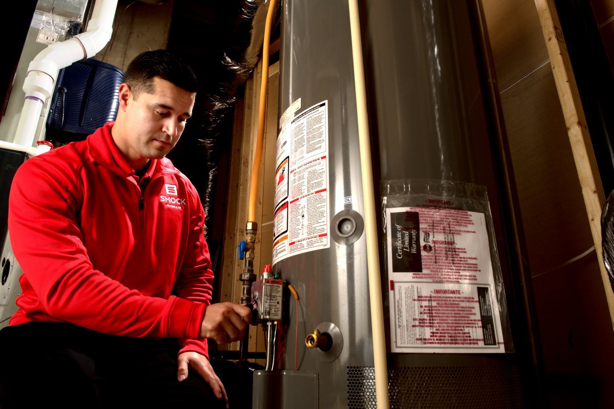 what is a water heater Smock worker installing new heater