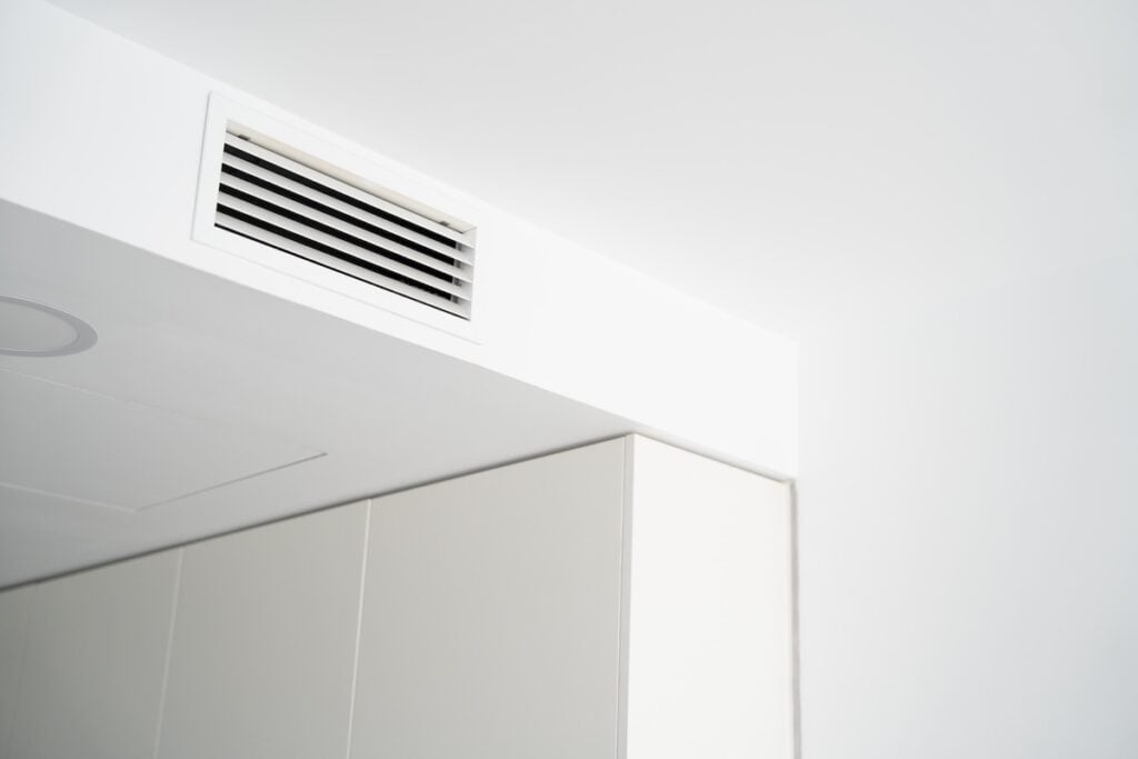 Bright modern apartment interior featuring a ceiling air ventilation