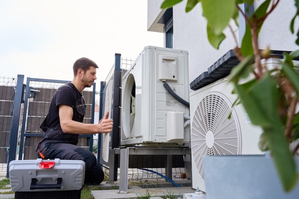 Technician performing maintenance hvac
