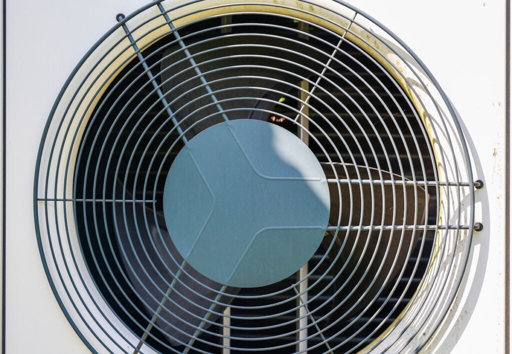 Air conditioning unit fan grill providing cooling and heating for energy efficiency