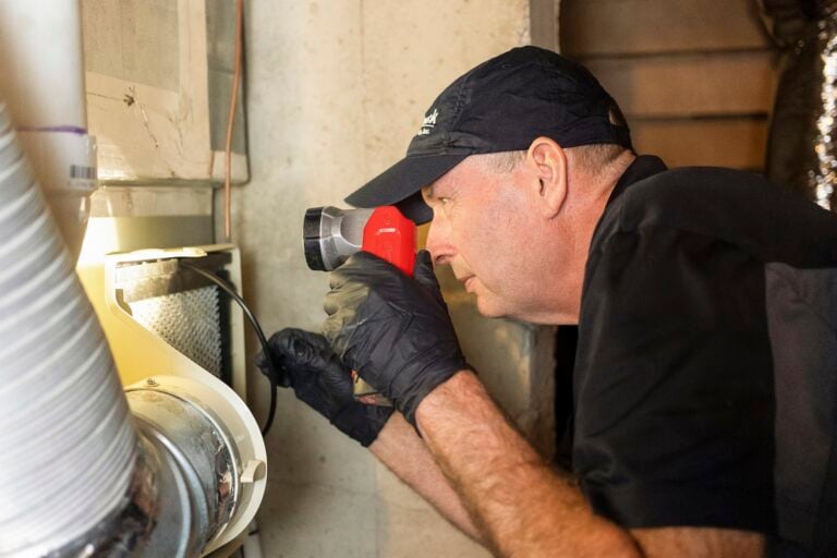 Smock worker fixing hvac