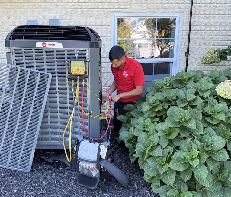 Smock worker fixing hvac unit